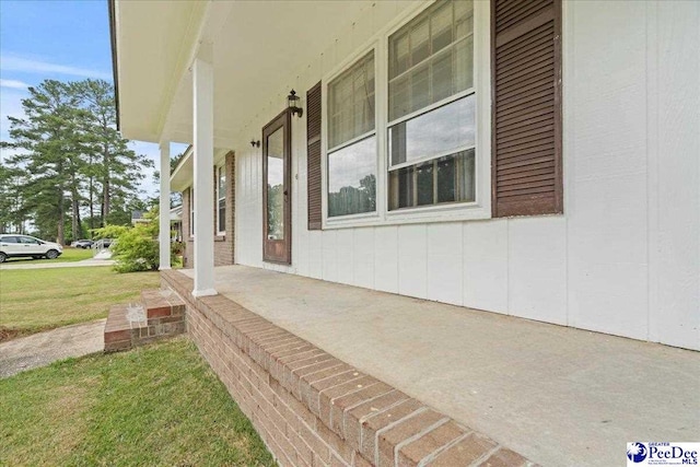 1216 Arrowood Dr, Florence, SC 29501 - view of side of property with covered porch and a yard