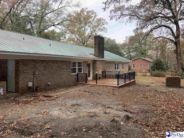 rear view of house with a deck