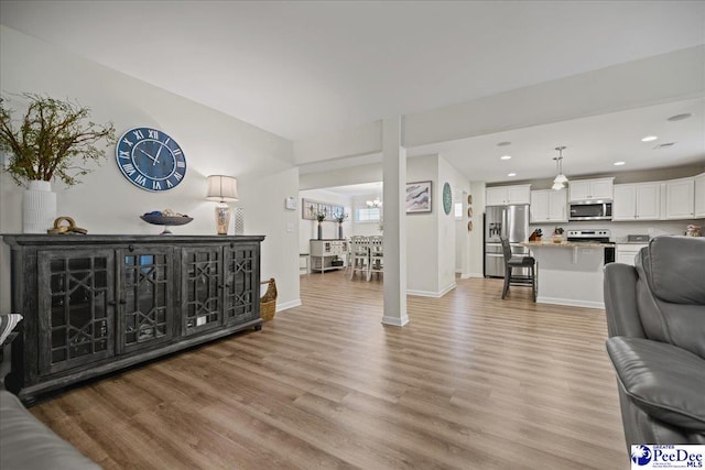 1757 Lake Wateree Dr, Florence, SC 29501 - living area with light wood finished floors and recessed lighting