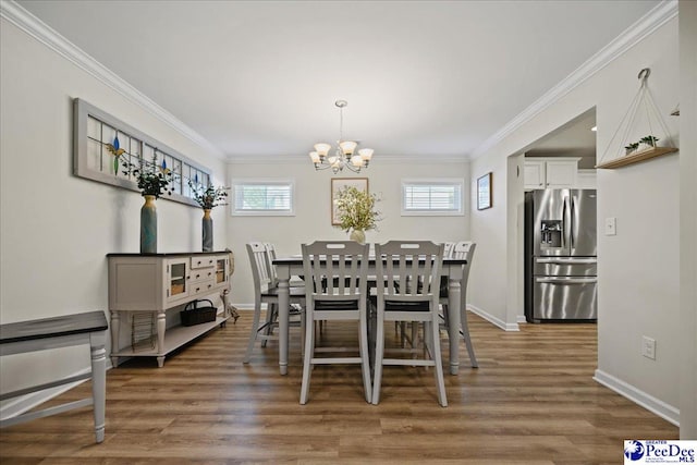 1757 Lake Wateree Dr, Florence, SC 29501 - dining room with a chandelier, crown molding, and wood finished floors
