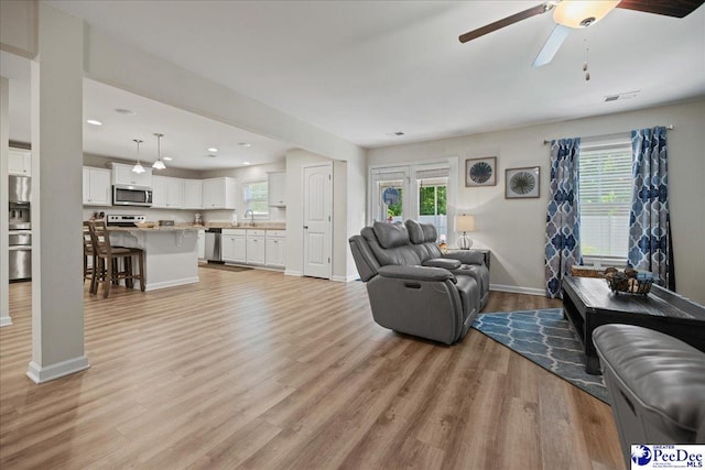 1757 Lake Wateree Dr, Florence, SC 29501 - living area featuring light wood-style flooring, a ceiling fan, and recessed lighting