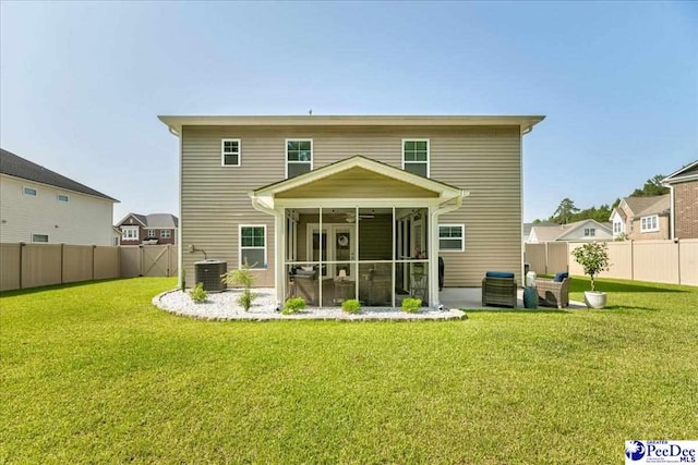 1757 Lake Wateree Dr, Florence, SC 29501 - back of house with a sunroom, a fenced backyard, and ceiling fan
