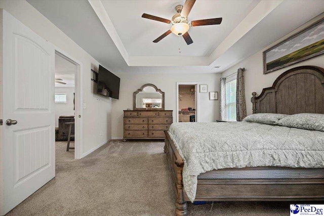 1757 Lake Wateree Dr, Florence, SC 29501 - bedroom featuring carpet flooring, a tray ceiling, and ceiling fan