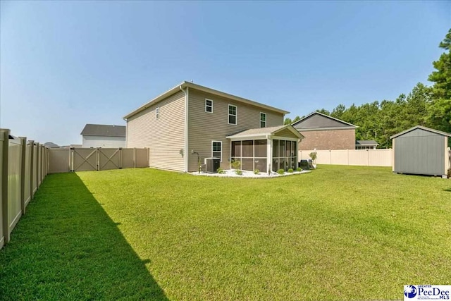 1757 Lake Wateree Dr, Florence, SC 29501 - back of property with a shed, a sunroom, and a fenced backyard