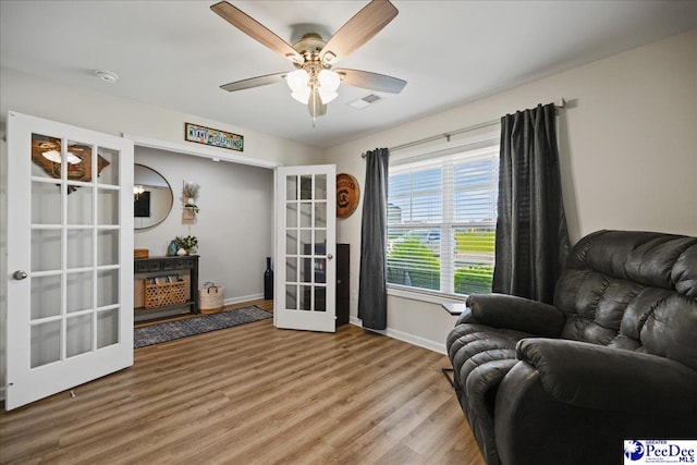 1757 Lake Wateree Dr, Florence, SC 29501 - living area with french doors, wood finished floors, and ceiling fan