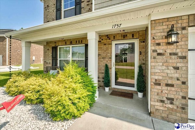 1757 Lake Wateree Dr, Florence, SC 29501 - doorway to property with brick siding and covered porch