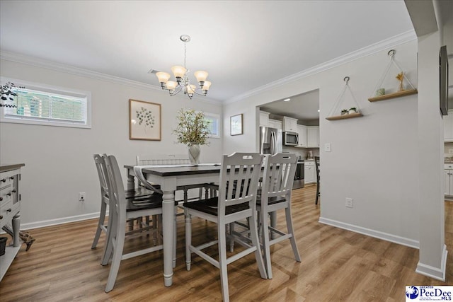 1757 Lake Wateree Dr, Florence, SC 29501 - dining area featuring a chandelier, light wood-style flooring, and ornamental molding