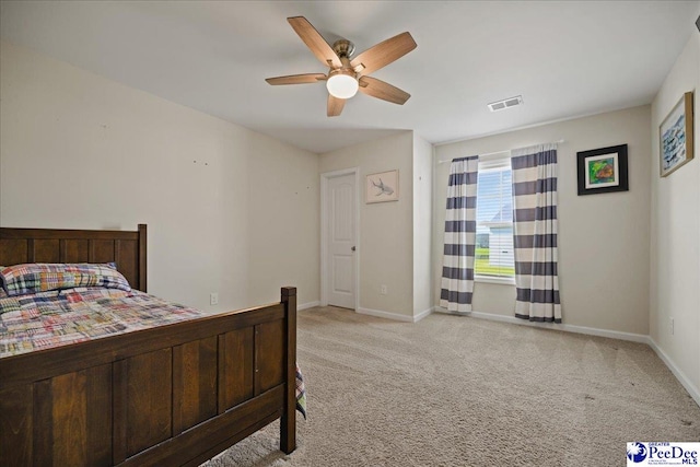1757 Lake Wateree Dr, Florence, SC 29501 - bedroom with light colored carpet and ceiling fan