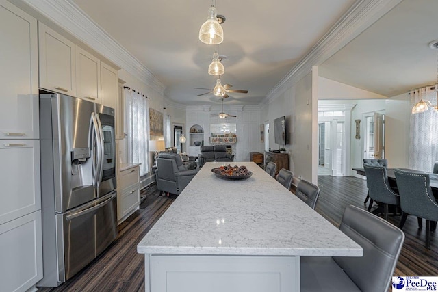 kitchen with open floor plan, stainless steel fridge with ice dispenser, ceiling fan, and dark wood finished floors