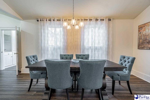 dining area featuring a notable chandelier, baseboards, vaulted ceiling, and dark wood-style floors