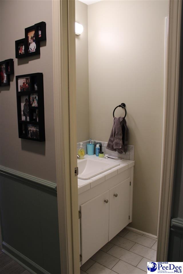 816 Madeira Ln, Florence, SC 29505 - bathroom with vanity and tile patterned flooring