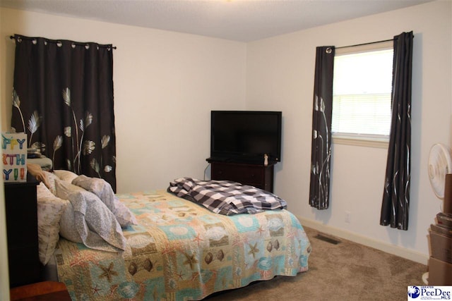 816 Madeira Ln, Florence, SC 29505 - bedroom featuring carpet floors and baseboards