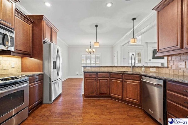 kitchen featuring a sink, ornamental molding, a healthy amount of sunlight, and stainless steel appliances