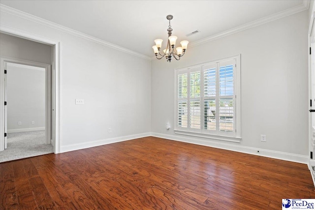 empty room featuring dark wood finished floors, an inviting chandelier, baseboards, and ornamental molding