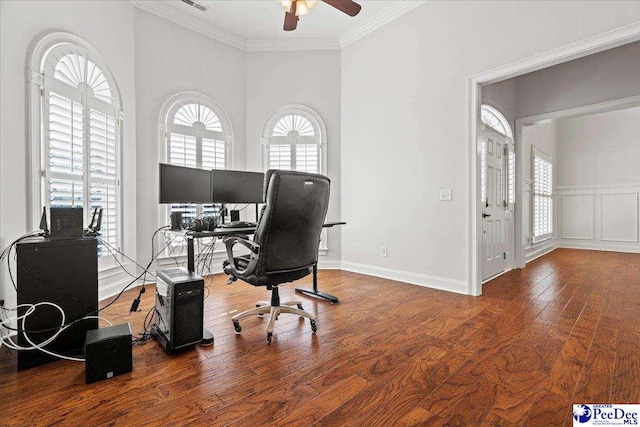 home office featuring baseboards, a ceiling fan, hardwood / wood-style floors, and crown molding