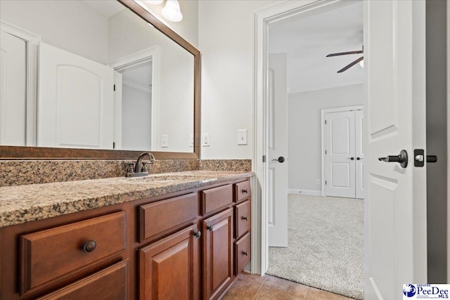 bathroom featuring ceiling fan and vanity