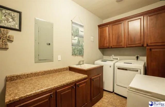 3438 Hammock Ct, Florence, SC 29501 - clothes washing area with a sink, separate washer and dryer, electric panel, light tile patterned floors, and cabinet space