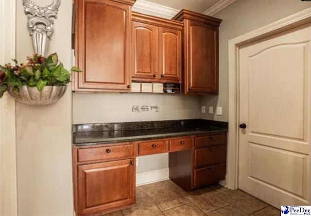 3438 Hammock Ct, Florence, SC 29501 - bar featuring built in study area, crown molding, and tile patterned floors