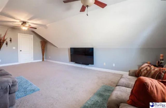 3438 Hammock Ct, Florence, SC 29501 - carpeted living room featuring lofted ceiling, baseboards, and ceiling fan