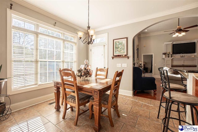 3438 Hammock Ct, Florence, SC 29501 - dining area with ceiling fan with notable chandelier, baseboards, arched walkways, and ornamental molding