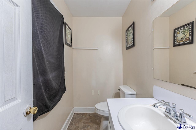 bathroom featuring sink and toilet