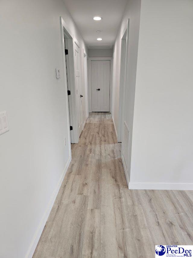 hallway featuring light wood-type flooring