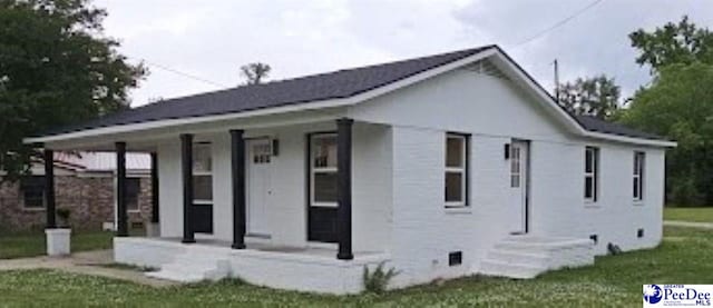 exterior space featuring a yard and covered porch