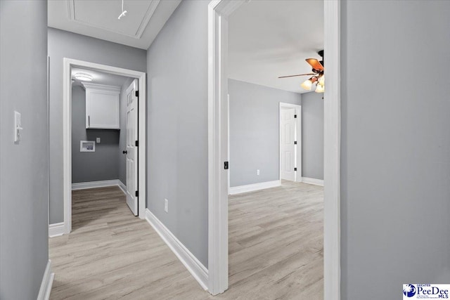 hallway with light wood-type flooring