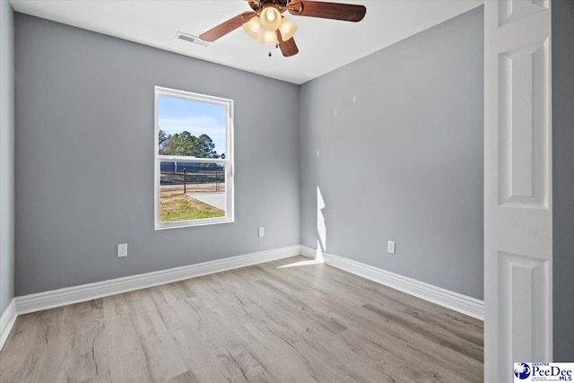 unfurnished room featuring light hardwood / wood-style flooring and ceiling fan