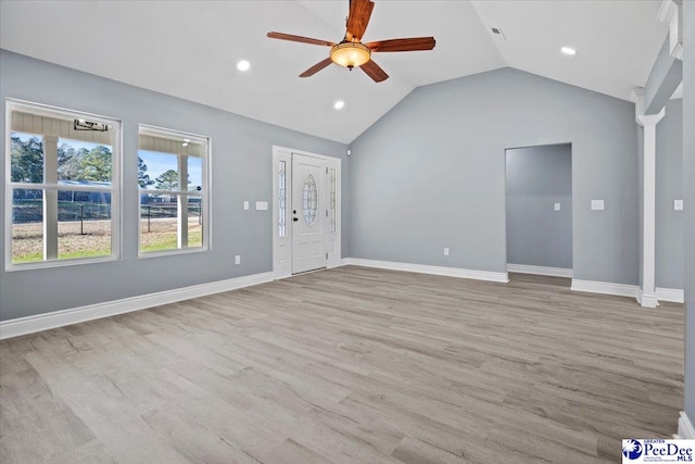 unfurnished living room with lofted ceiling, light hardwood / wood-style floors, and ceiling fan