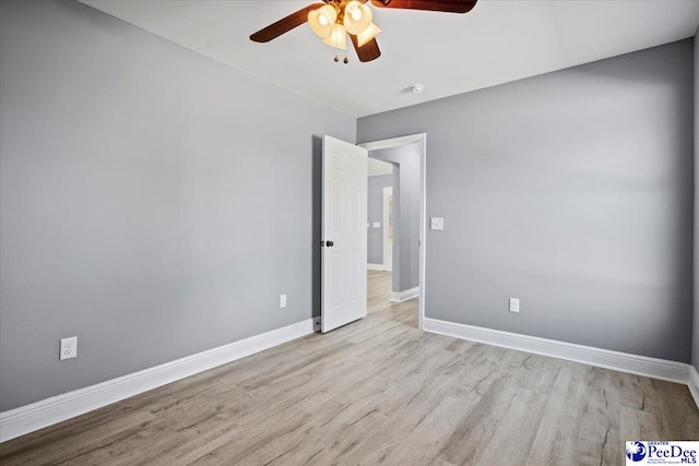 unfurnished room with light hardwood / wood-style flooring and ceiling fan