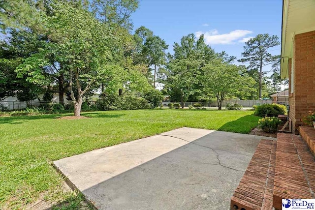1812 Woods Dr, Florence, SC 29505 - fenced backyard with a patio area