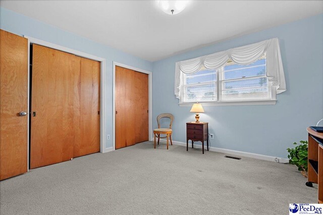 1812 Woods Dr, Florence, SC 29505 - living area featuring carpet flooring and baseboards