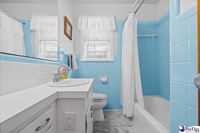 1812 Woods Dr, Florence, SC 29505 - bathroom featuring vanity, tile walls, shower / tub combo, and tile patterned floors