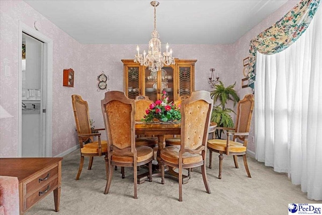 1812 Woods Dr, Florence, SC 29505 - dining space with a chandelier and light colored carpet