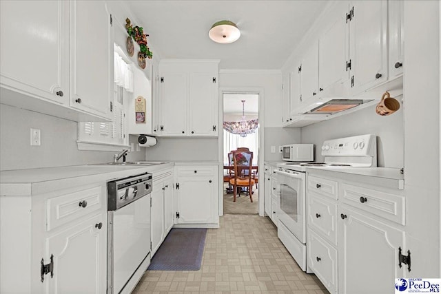 1812 Woods Dr, Florence, SC 29505 - kitchen with white appliances, light countertops, white cabinets, a chandelier, and ornamental molding