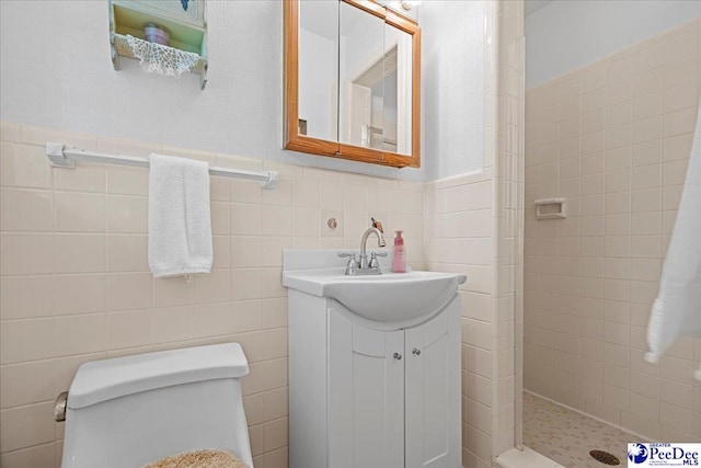 1812 Woods Dr, Florence, SC 29505 - full bathroom with a tile shower, tile walls, and vanity
