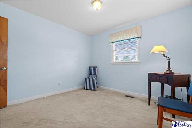 1812 Woods Dr, Florence, SC 29505 - living area featuring carpet and baseboards