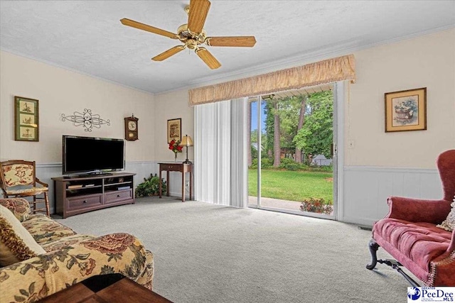 1812 Woods Dr, Florence, SC 29505 - carpeted living room featuring crown molding, a wainscoted wall, and ceiling fan