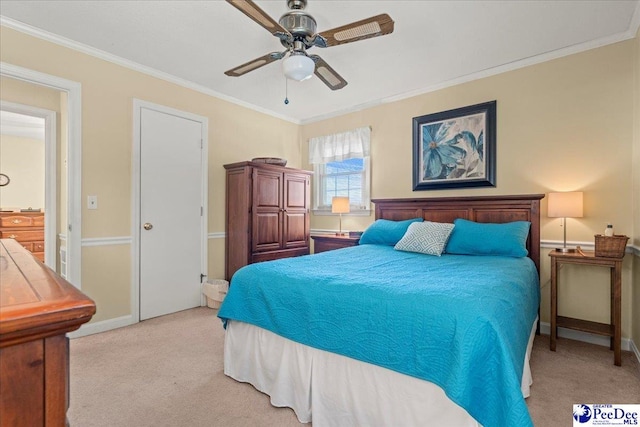 bedroom featuring a ceiling fan, baseboards, light colored carpet, and crown molding