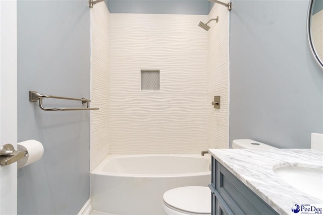 full bathroom with tiled shower / bath combo, vanity, and toilet