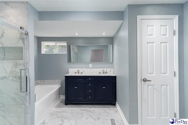 bathroom featuring shower with separate bathtub and vanity