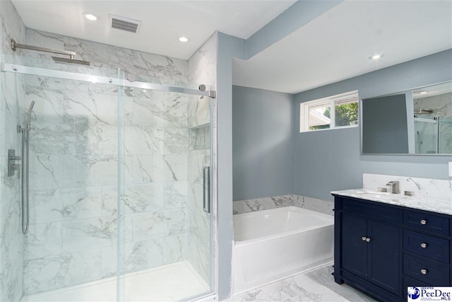 bathroom featuring vanity and plus walk in shower