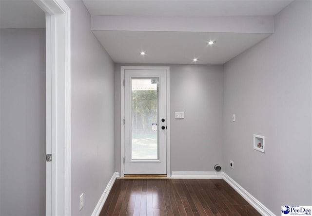 interior space with electric dryer hookup, dark hardwood / wood-style floors, and washer hookup