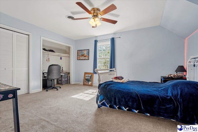 carpeted bedroom with lofted ceiling, visible vents, a ceiling fan, and baseboards