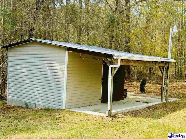 view of outbuilding with a wooded view