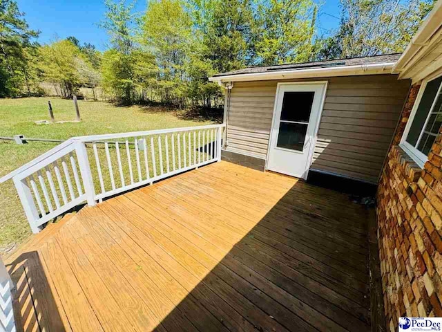 deck featuring a yard