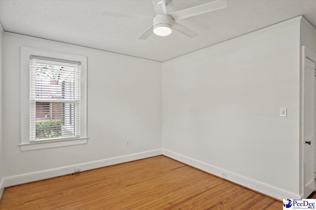 312 Greene St, Cheraw, SC 29520 - empty room featuring a textured ceiling, wood finished floors, baseboards, and ceiling fan
