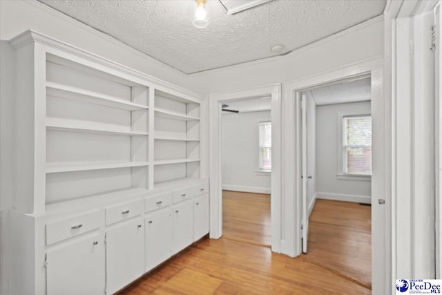 312 Greene St, Cheraw, SC 29520 - hallway featuring a textured ceiling, light wood-style flooring, and baseboards