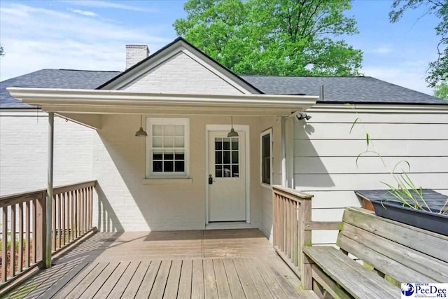 312 Greene St, Cheraw, SC 29520 - entrance to property with roof with shingles, a deck, and a chimney